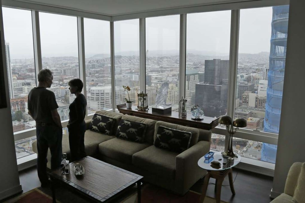 Jerry Dodson and his wife Pat stand inside their home on the 42nd floor of the Millennium Tower in San Francisco. The 58-storey tower has gained notoriety in recent weeks as the leaning tower of San Francisco. Photo: AP