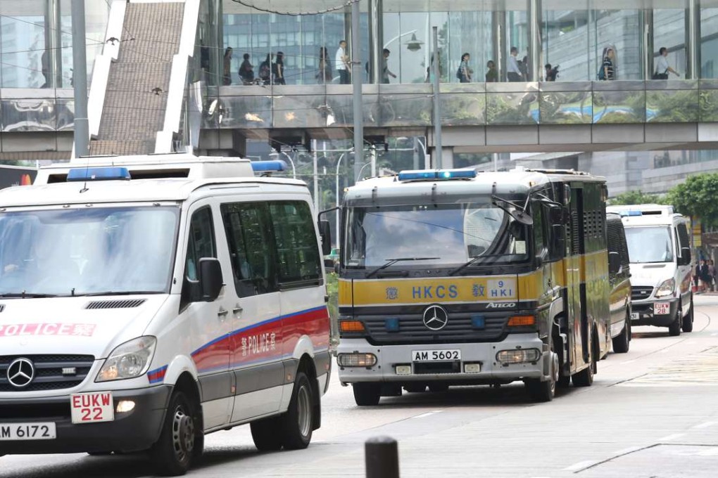 Armoured vehicles transport Rurik Jutting to the High Court. Photo: Dickson Lee