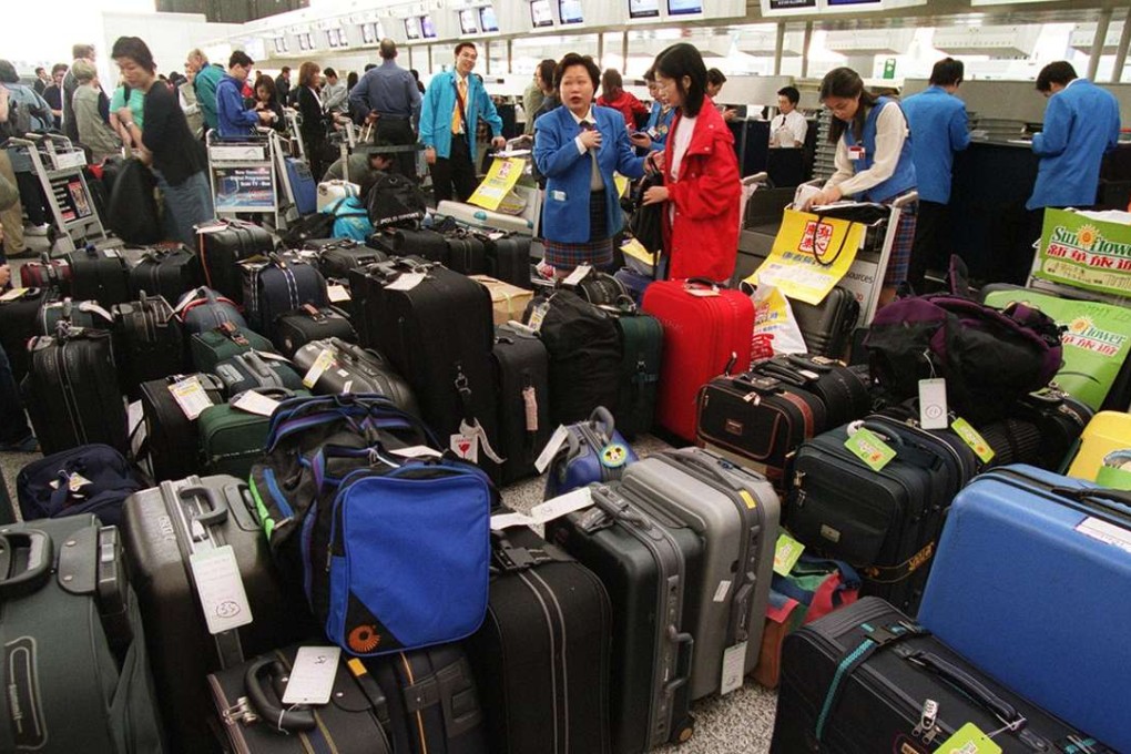 Tour guides take care of their clients’ luggage at Hong Kong international airport. A new report suggests, however, that more Chinese tourists are wanting to travel alone or with family, rather than join an organised tour.