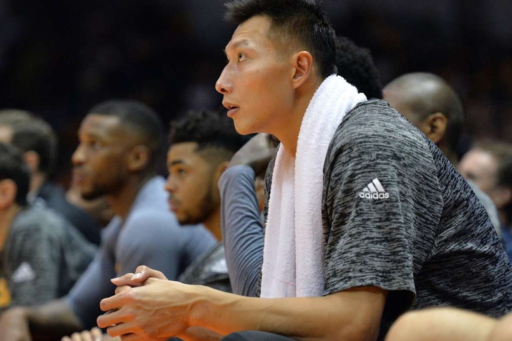 Los Angeles Lakers forward Yi Jianlian (11) looks on from the bench during the fourth quarter against the Golden State Warriors at Valley View Casino Center. Mandatory Credit: Jake Roth-USA TODAY Sports