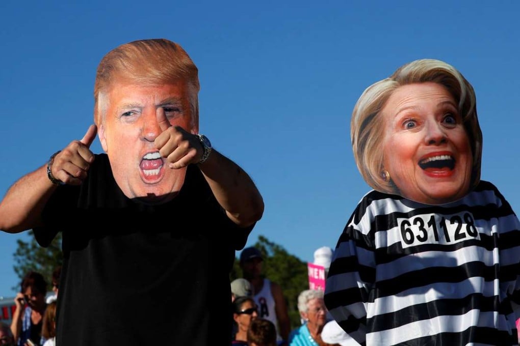Supporters of Donald Trump make their feelings clear about US presidential rival Hillary Clinton at a campaign rally in Naples, Florida, on October 23. Photo: Reuters