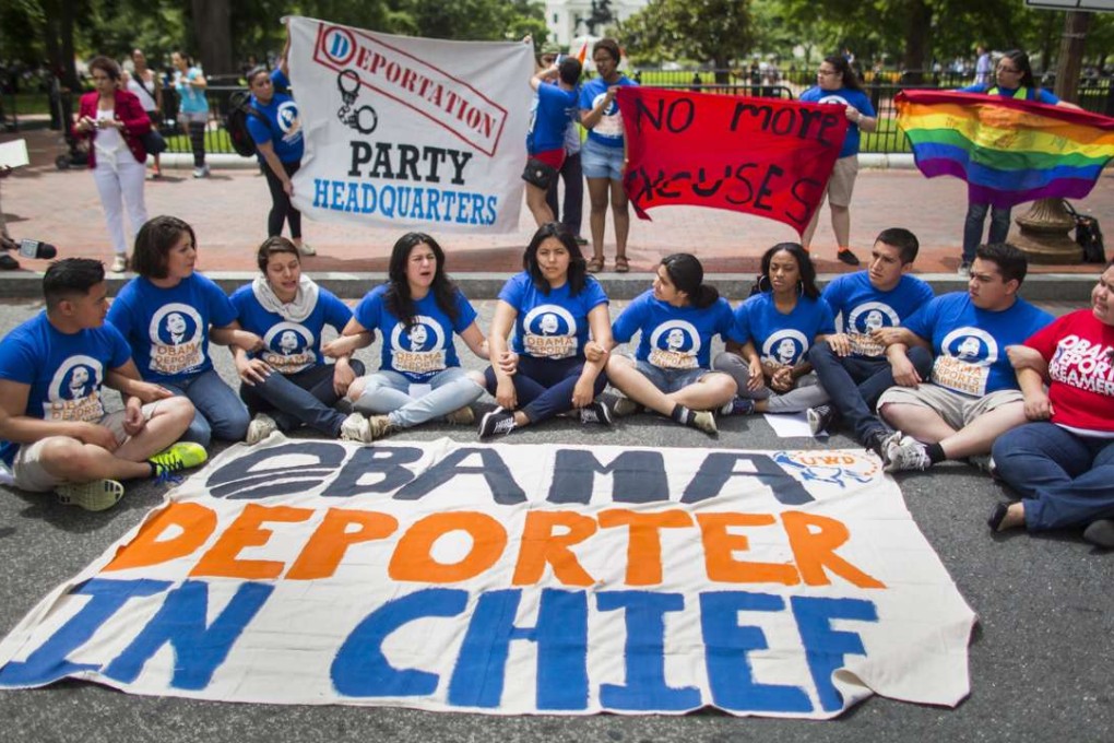 Activists with the pro-immigration organisation 'United We Dream' block traffic on H Street in Wahsington DC in 2014 during a rally to protest President Barack Obama's decision to delay for two months his revisions of deportation policies. Photo: EPA