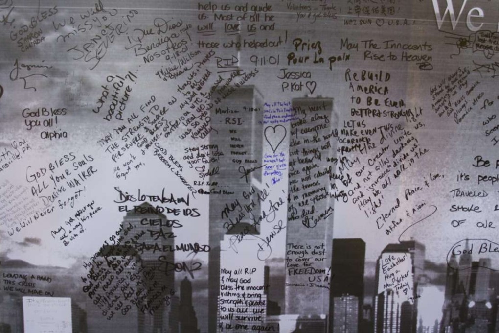 A banner showing the Twin Towers of the World Trade Centre covered with messages of condolence. Picture: EPA