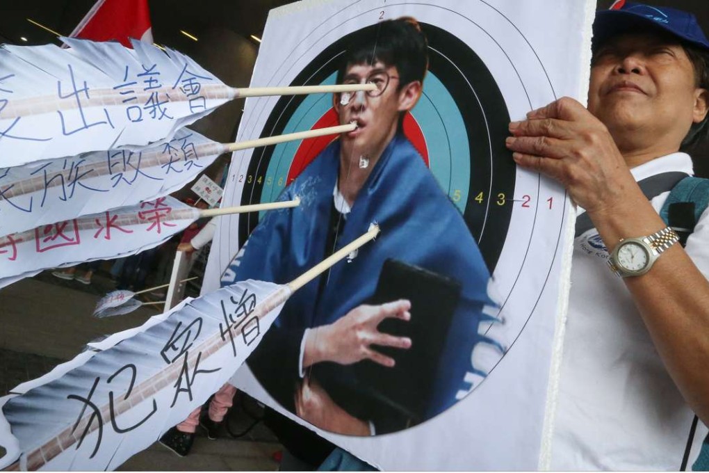 One protester holds an anti-Baggio Leung sign. Photo: K. Y. Cheng