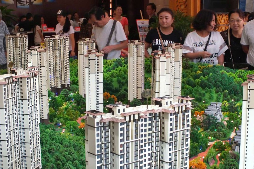 Chinese home buyers at a housing fair in Yichang,Hubei province. According to a recent media briefing by the National Bureau of Statistics, the property boom helped support gross domestic product by roughly 8 per cent in the third quarter of 2016. Photo: AFP