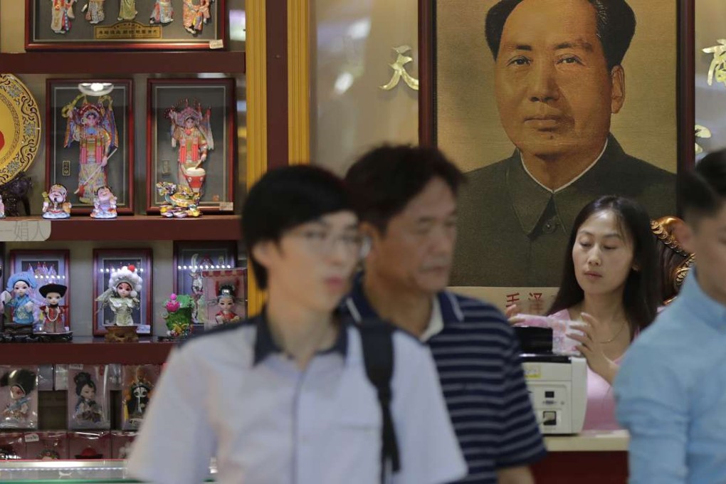 Capital outflows are on track to reach 130 billion yuan per quarter in 2017, according to BAML. Visitors at a shop selling decorative souvenirs near Tiananmen Square in Beijing on September 9., 2016. Photo: AP