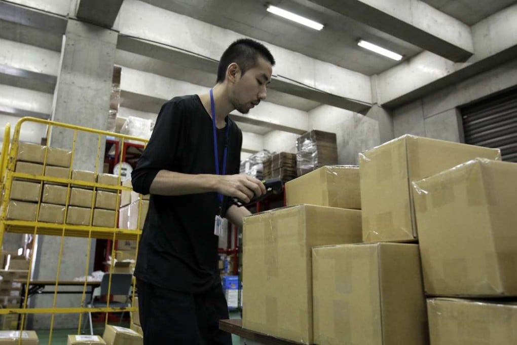 Online purchases of daily consumablesin China is expected to undergo steady growth as more consumers aged 30 and above shop over the internet. A Tokyo employee of Wandou, which ranked as one of most downloaded shopping apps in China in June. Photo: Bloomberg