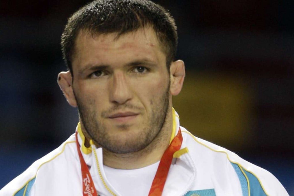 Kazakhstan's Taimuraz Tigiyev wears his silver medal in the 96kg freestyle match at the 2008 Olympics in Beijing. Nine more athletes, including six medal winners, were retroactively disqualified from the 2008 Beijing Olympics on Wednesday, October 26, 2016 after failing retests of their doping samples. Stripped of silver medals were freestyle wrestlers Soslan Tigiev of Uzbekistan (66-74 kilogram division) and Taimuraz Tigiyev of Kazakhstan (84-96 kg). Photo: AP