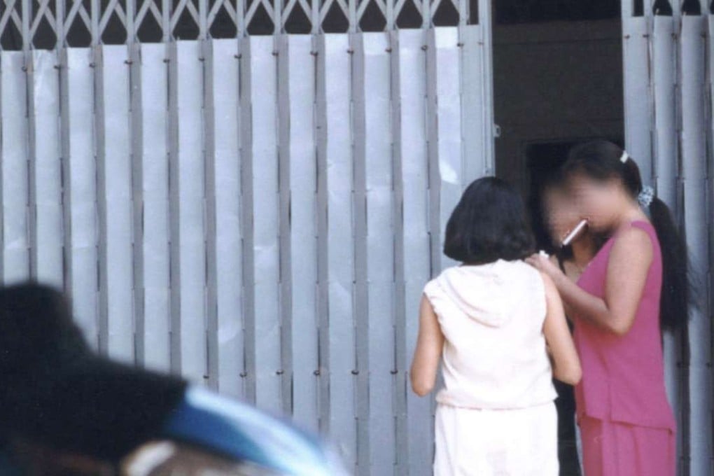 Sex workers on Svay Pak's main brothel strip. Mamasans there sell teenage girls’ viriginity to the highest bidder. Photo: James Thompson