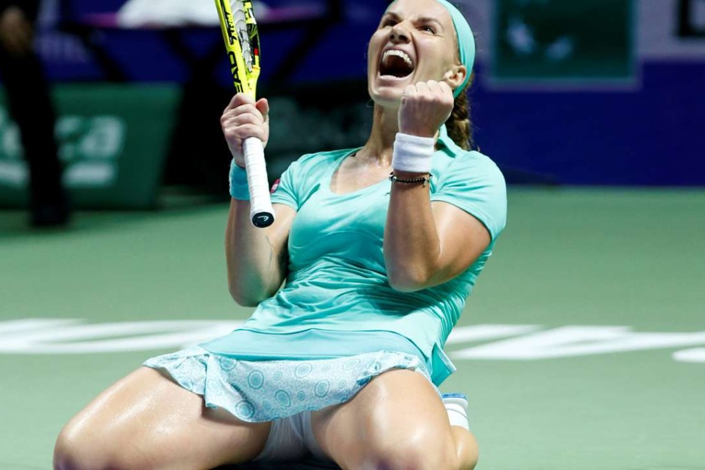Svetlana Kuznetsova, of Russia, celebrates after defeating Karolina Pliskova in Singapore. Photo: Reuters