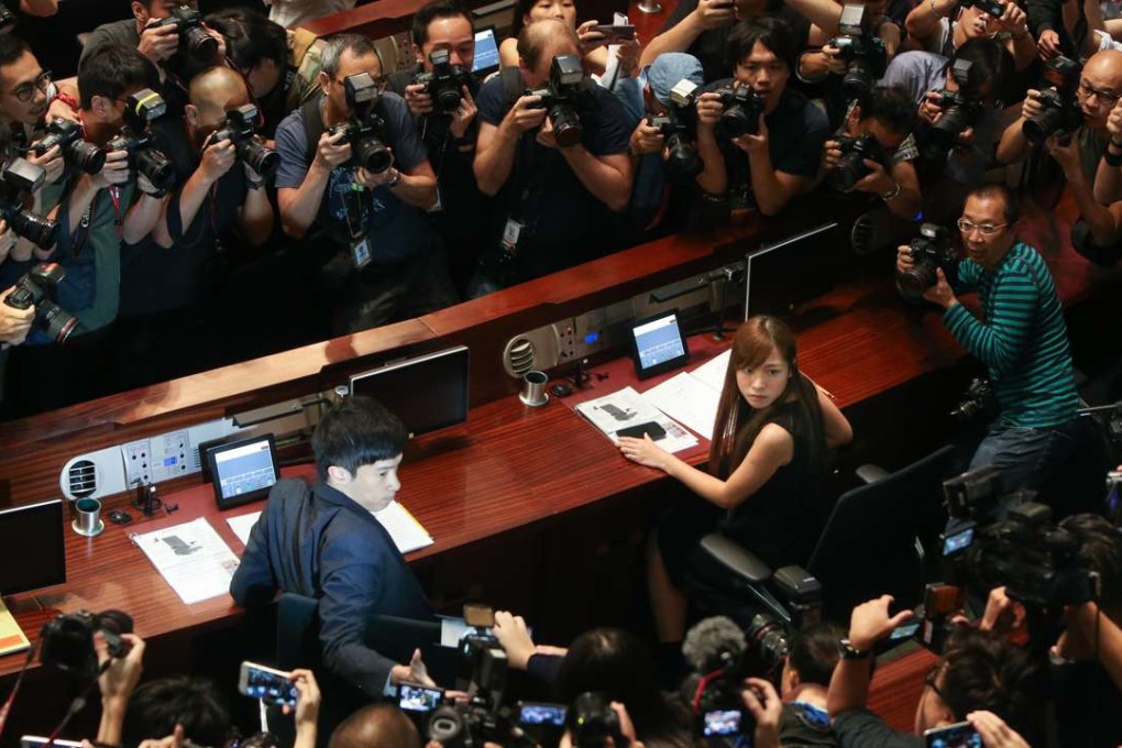 Localist lawmakers Sixtus Baggio Leung Chung-hang and Yau Wai-ching in the Legco chamber following their forced entry. Photo: Dickson Lee