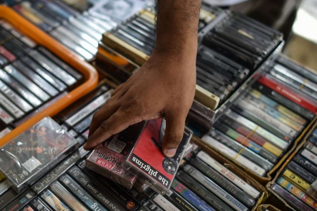 A shopper browsing cassettes on International Cassette Store Day in Subang Jaya. Photo: AFP
