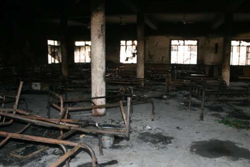 Bed frames are strewn in a burnt-out dormitory of the Balochistan Police College in Quetta on October 26, 2016, a day after the militants' attack. Pakistan mourned the killing of at least 62 people in a brutal gun and suicide bomb assault on a police academy, the deadliest attack on a security installation in the country's history. / AFP PHOTO / BANARAS KHAN