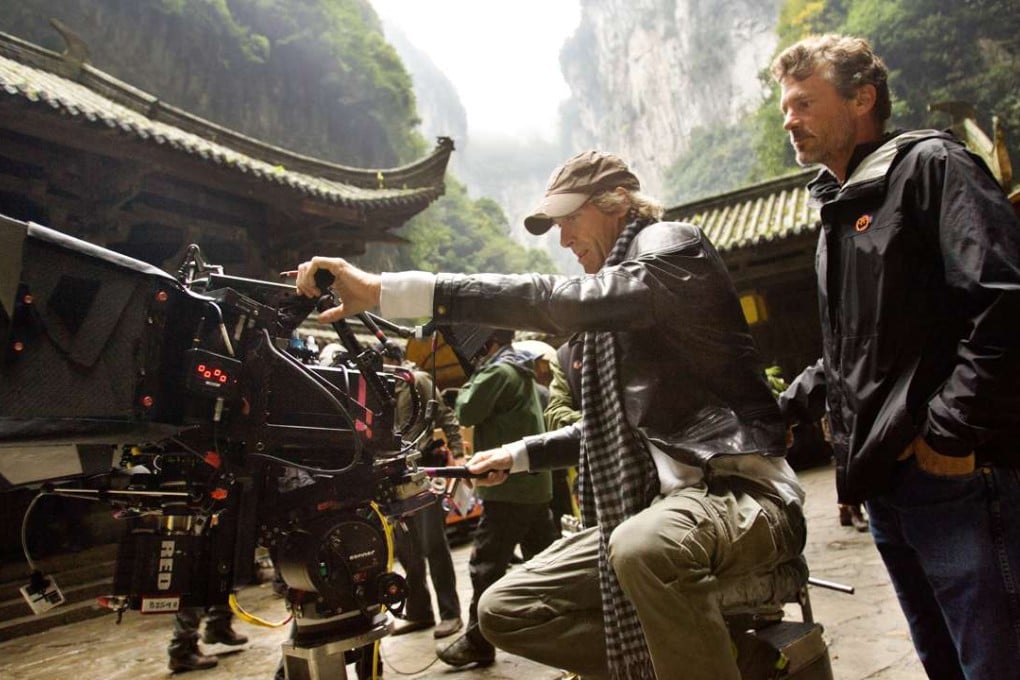 Director Michael Bay lines up a shot for camera operator John Skotchdopole in Wulong Karst National Park in China during filming of Transformers: Age of Extinction. Photo: Paramount Pictures