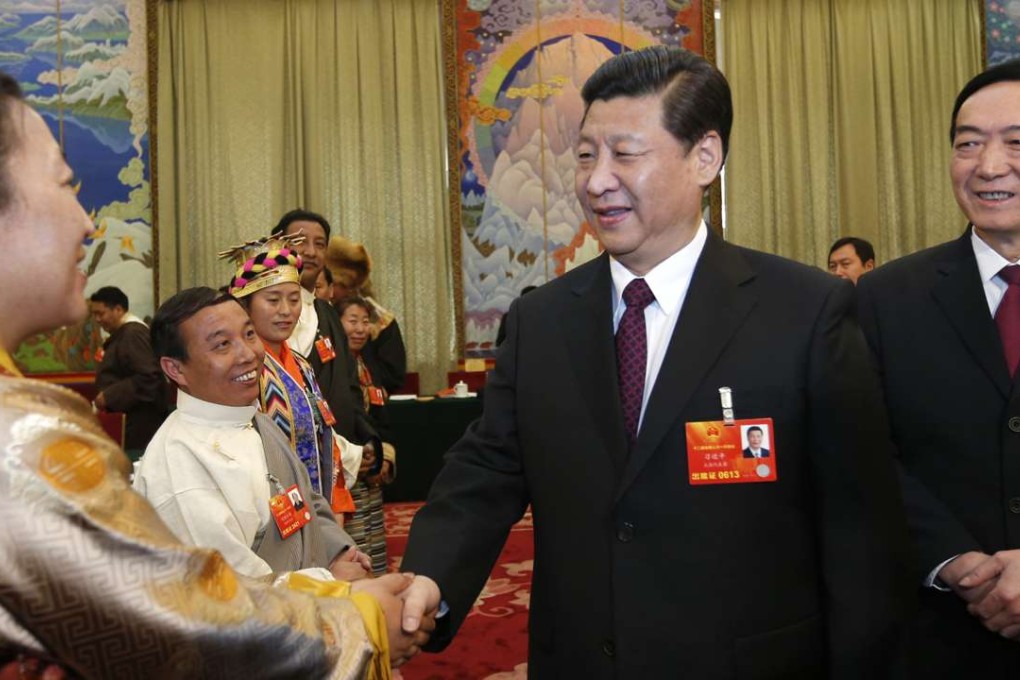 Chen Quanguo (right) accompanies Communist Party general secretary Xi Jinping as he greets a National People’s Congress deputy from Tibet in Beijing in 2013. Photo: Xinhua