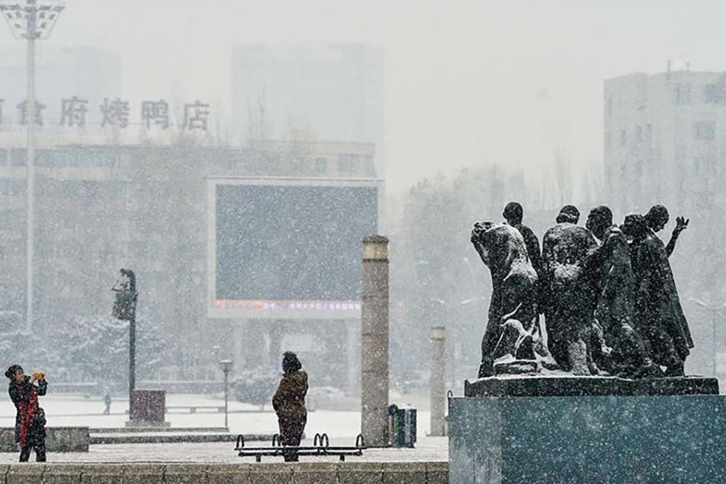 People take photos in Changchun Cultural Plaza, Jilin province, on Sunday. Photo: SCMP Pictures