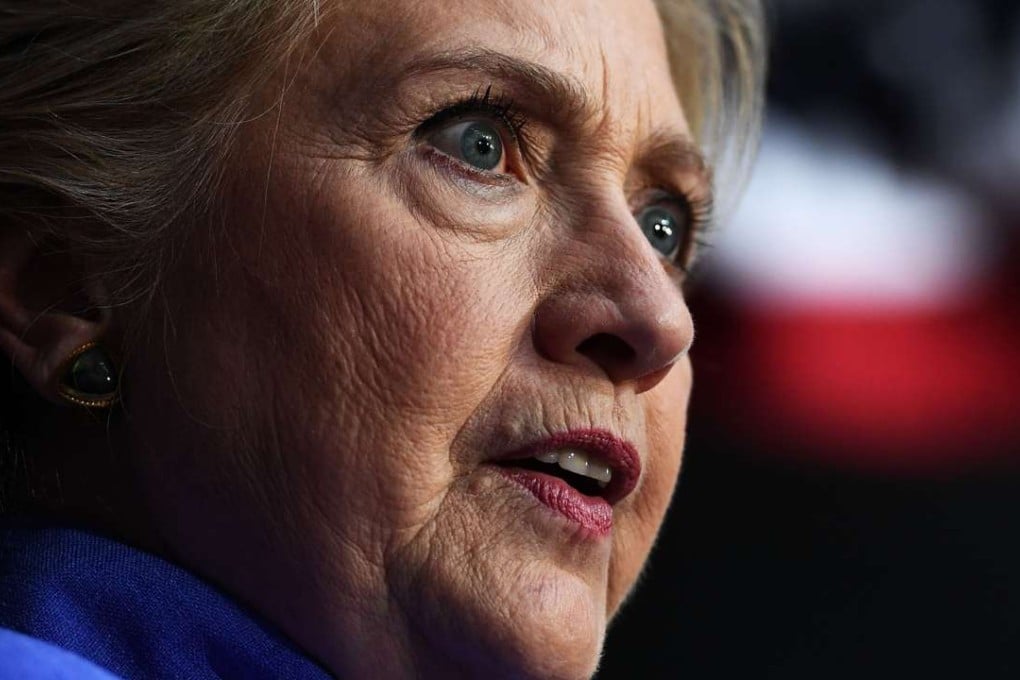 US Democratic presidential nominee Hillary Clinton speaks at a rally in Wilton Manors, Florida, on Sunday. Her campaign is battling to contain the fallout from the revival of an FBI investigation into her email practices. Photo: AFP