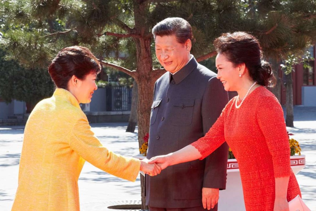President Xi Jinping and first lady Peng Liyuan welcome South Korean President Park Geun-hye at Tiananmen Square in September last year. Park was in Beijing to attend a military parade to mark the 70th anniversary of the end of the second world war. Photo: EPA
