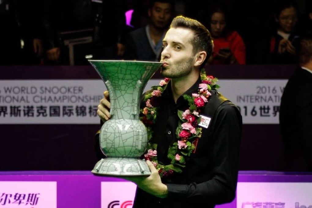 Mark Selby celebrates with the trophy after winning the International Championship in Daqing on Sunday. Photos: World Snooker