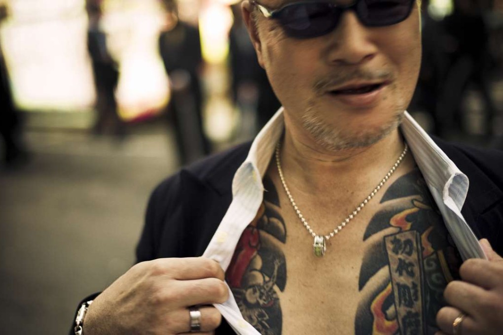 A yakuza showing off his tattoo. Photo: SCMP Pictures
