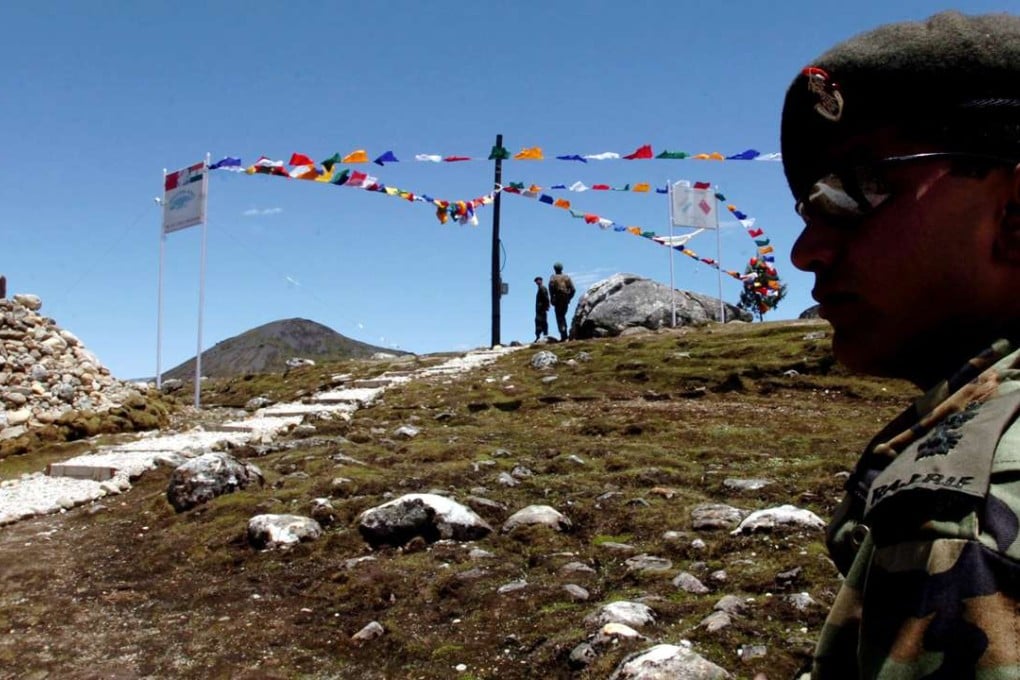An Indian army major watches Indian post at a 15,500ft high mountain pass on the McMahon Line, about 47km from Tawang, in Bumla, Arunachal Pradesh. Photo: AFP