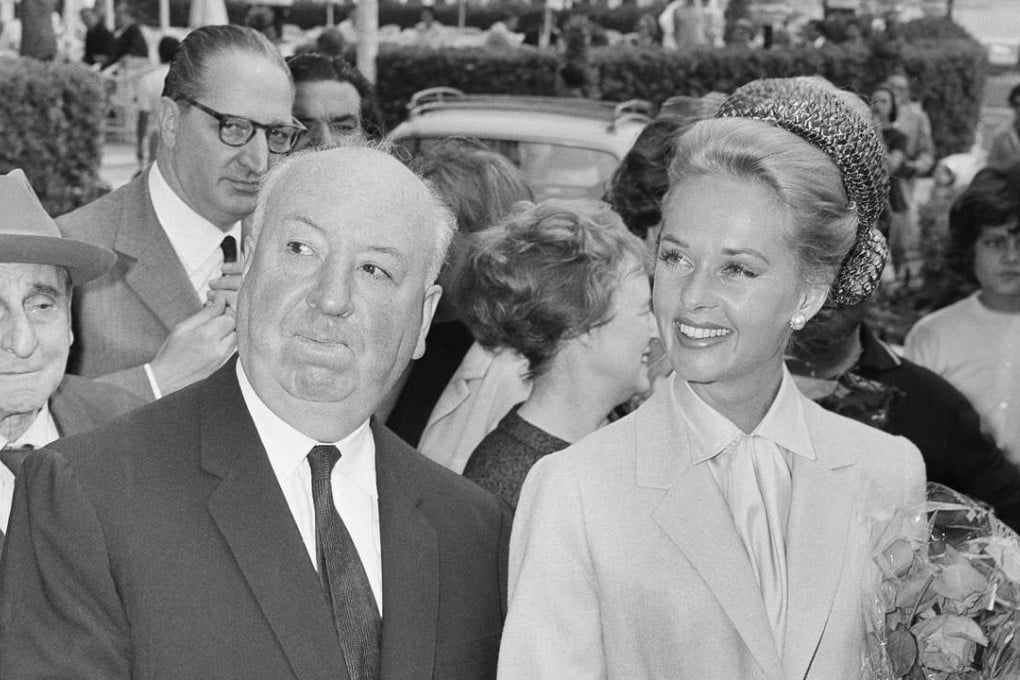 In this 1963 file photo, director Alfred Hitchcock and American actress Tippi Hedren arrive at the Carlton Hotel in Cannes, France for the presentation of The Birds. The New York Post reports Hedren has detailed the sexual harassment she says she suffered from Hitchcock in a new memoir. Photo: AP