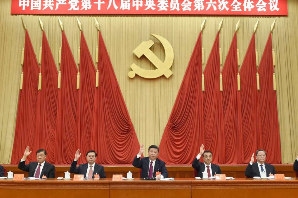 President Xi Jinping (centre), flanked by Premier Li Keqiang (right) and National People’s Congress Standing Committee chairman Zhang Dejiang, leads proceedings at the sixth plenum of the 18th party central committee in Beijing on October 27. Photo: Xinhua