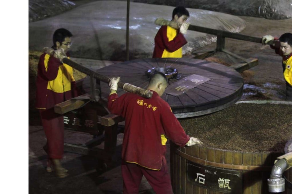 Workers producing Chinese liquor, most often referred to as baijiu, at Luzhou Laojiao in Luzhou, Sichuan province. Photo: Dickson Lee