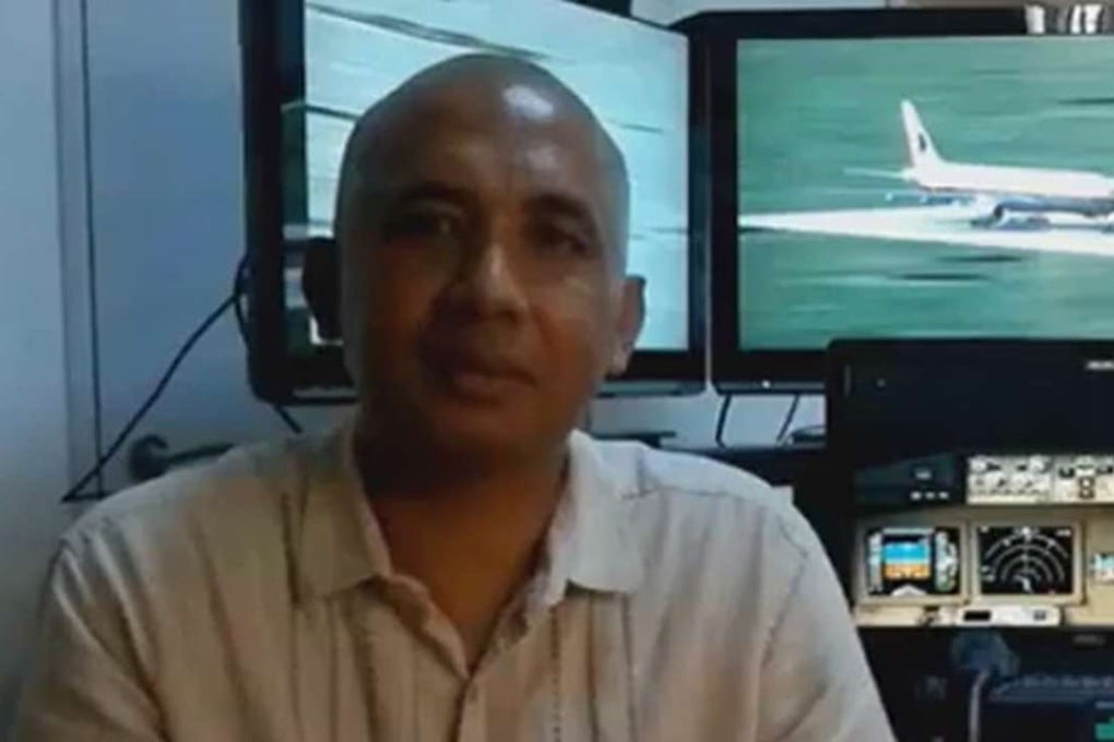 Captain Zaharie Ahmad Shah, the pilot of doomed flight MH370, with the flight simulator he built. A report into missing Malaysia Airlines Flight MH370 by the Australian safety investigator leading the search supports its view that the aircraft descended rapidly after running out of fuel with no human intervention. File photo: SCMP Picture