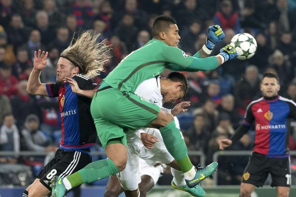 Basel's Birkir Bjarnason, Paris' goalkeeper Alphonse Areola and Thiago Silva, from left, fight for the ball during an UEFA Champions League Group stage Group A matchday 4 soccer match between Switzerland's FC Basel 1893 and France's Paris Saint-Germain EPA/GEORGIOS KEFALAS