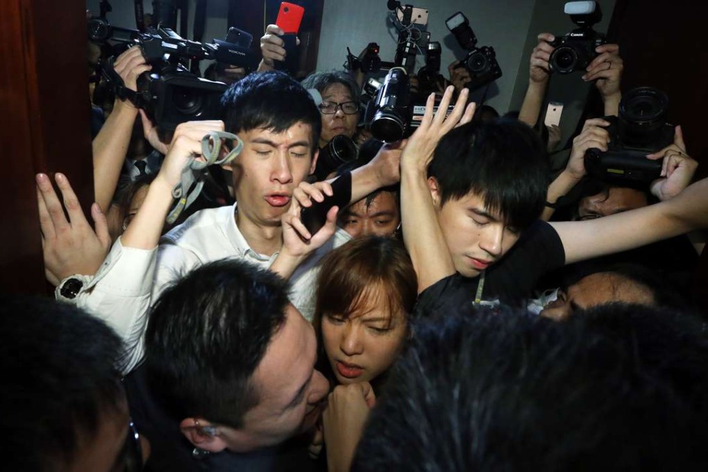 Sixtus Baggio Leung Chung-hang (white shirt) and Yau Wai-ching (centre front) trying to enter the Legco conference room. Photo: Sam Tsang