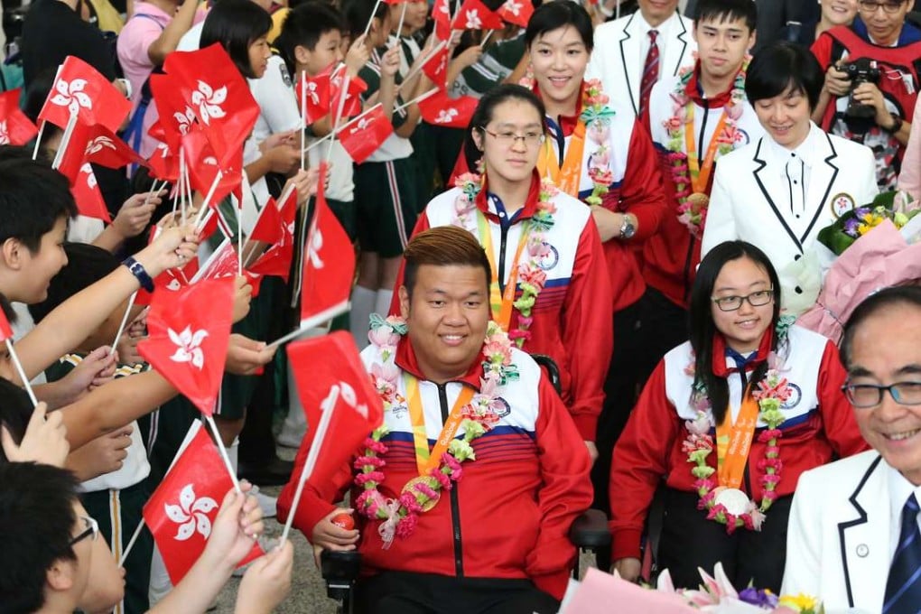 Rio Paralympic Games gold medallist Leung Yuk-wing leads the Hong Kong team on their return from Rio. Photo: K. Y. Cheng