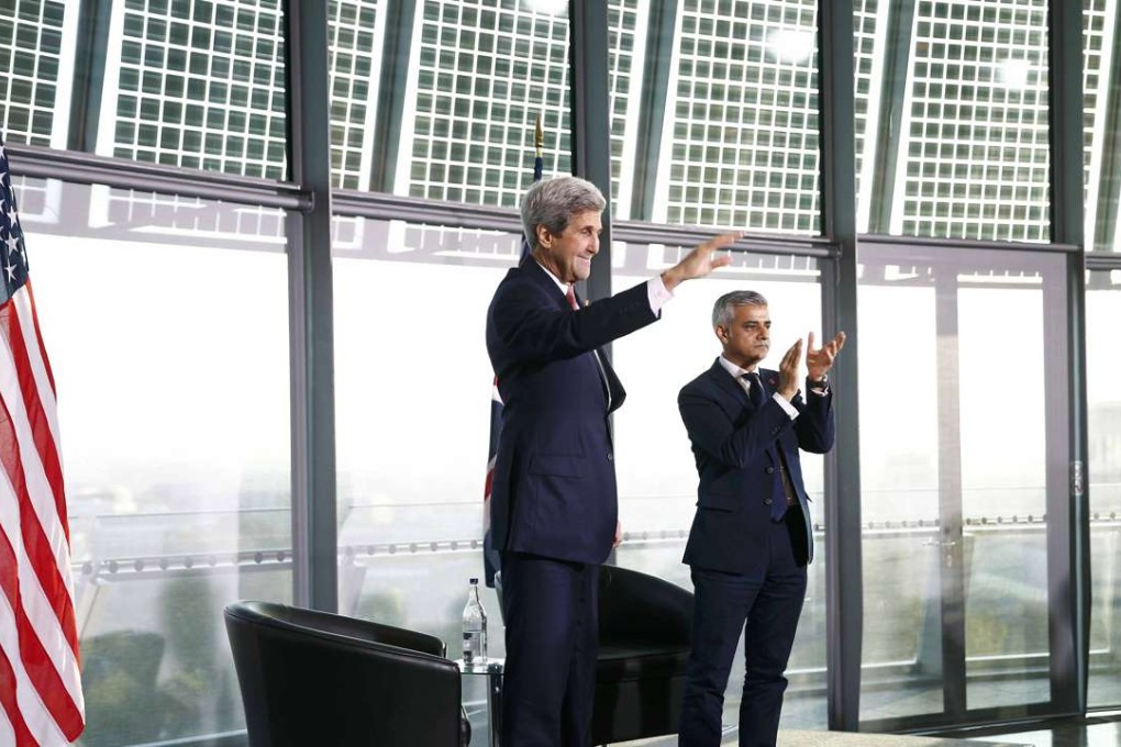 US Secretary of State John Kerry (L) reacts to applause as her stands with London Mayor Sadiq Khan during a town hall event at City Hall in London, Kerry met with a senior Chinese official in New York on Monday. Photo: Reuters