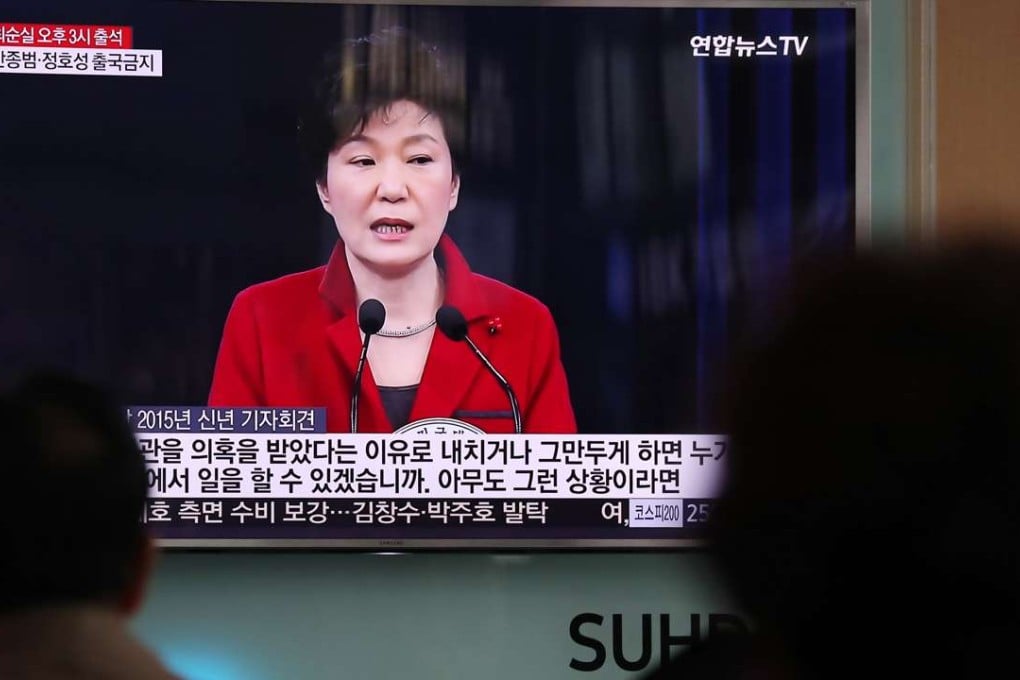 People watch a television screen showing an image of Park Geun-hye, South Korea's president, during a news broadcast at Seoul Station in South Korea. Photo: Bloomberg