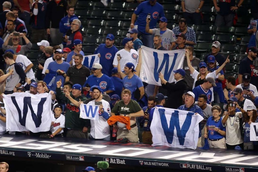 Chicago Cubs fans wave W flags after game six of the 2016 World Series against the Cleveland Indians at Progressive Field. Charles LeClaire-USA TODAY Sports