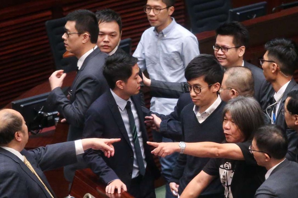 The Standing Committee of the National People’s Congress looks set to intervene this week in the row over the two localist lawmakers’ swearing-in debacle, with an interpretation of the Basic Law. Photo: K. Y. Cheng
