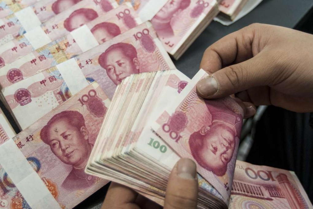 *** ONE TIME USE ONLY *** A Chinese clerk counts RMB (renminbi) yuan banknotes at a bank in Nantong city, east China's Jiangsu province, 1 March 2016. Photo Imaginechina