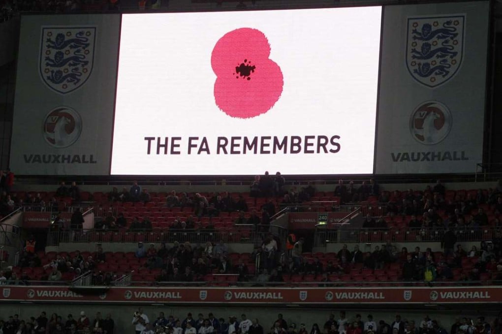 A poppy is displayed on a big screen for Armistice Day before the international friendly soccer match between England and Spain at Wembley Stadium in London in 2011. Photo: AP