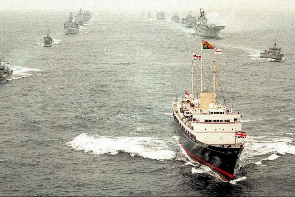 The departing Royal Yacht Britannia, carrying the Prince of Wales and former governor Chris Patten, leads Royal Navy vessels in a ceremonial “steam past” to the south of Hong Kong, on July 1, 1997. Pictures: Reuters; SCMP
