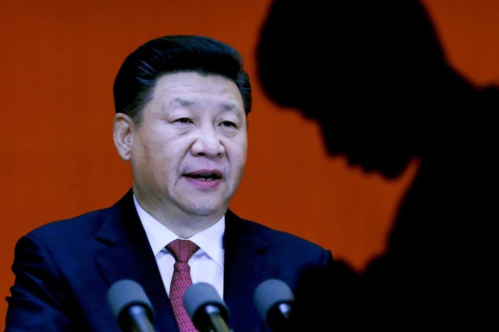 A man walks past an image of Chinese President Xi Jinping on display at the military museum in Beijing. Having punished more than a million Communist Party members for corruption, Xi used a key meeting to drive home the message that his signature anti-graft campaign is far from over. Photo: AP