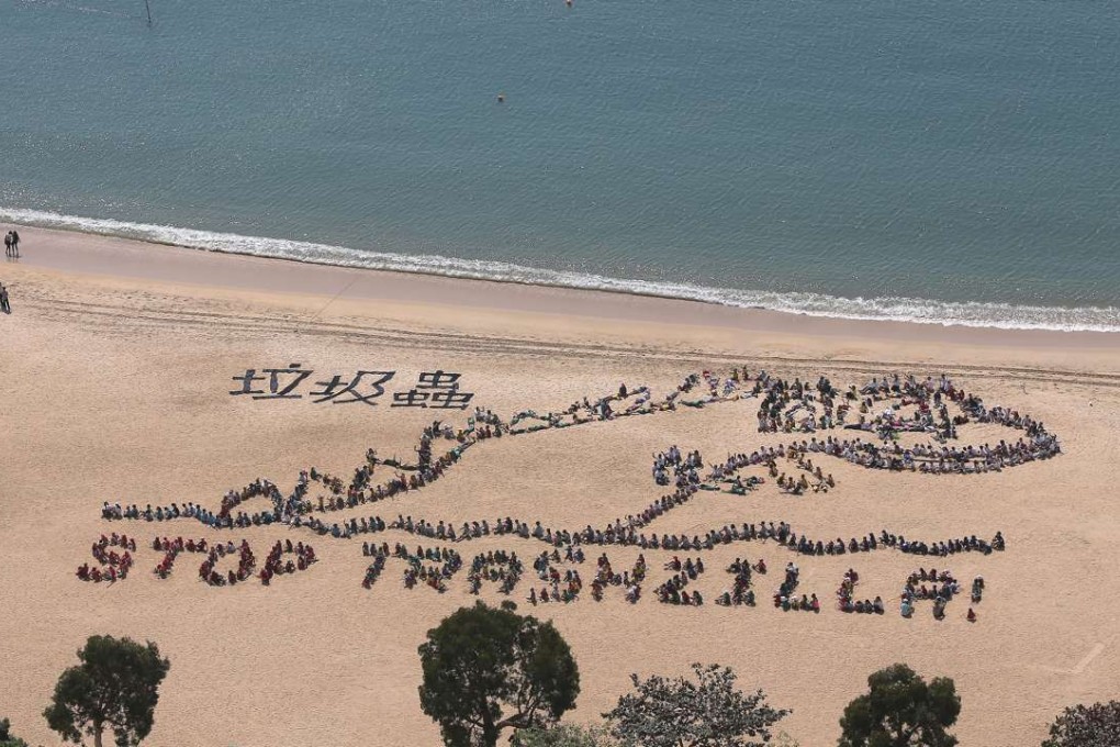 Human aerial art on Hong Kong beach aims to draw attention to ocean ...