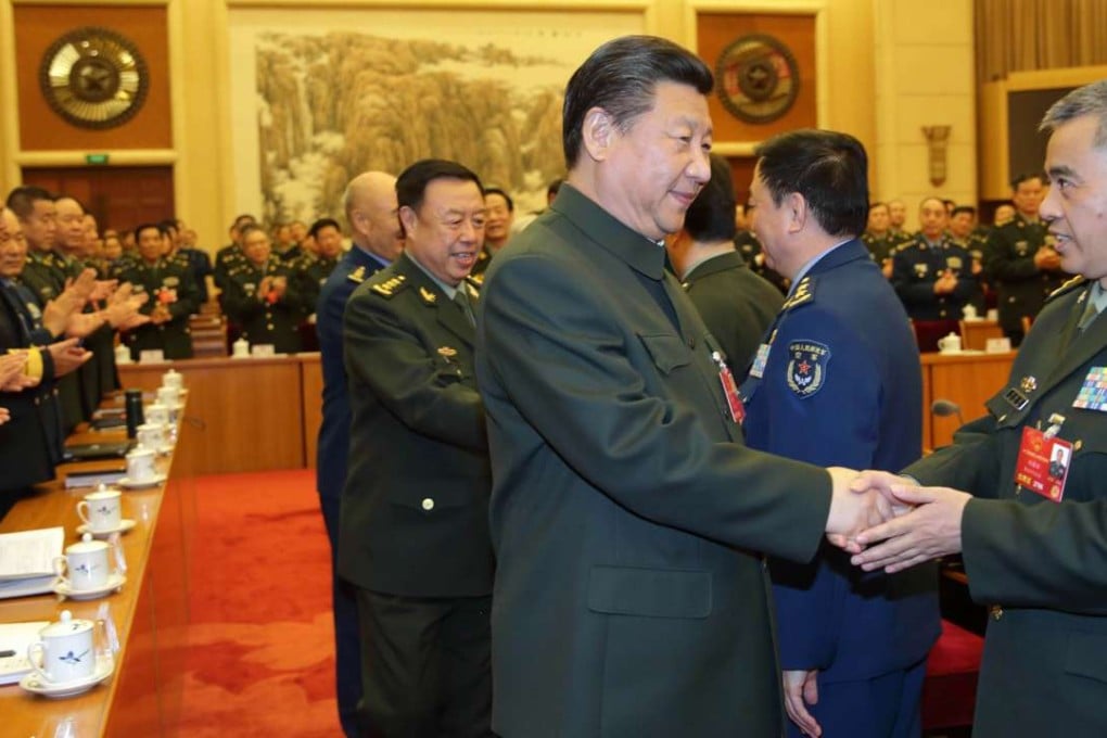 President Xi Jinping shakes hands with a PLA deputy during a meeting of the army’s delegation to the annual session of the National People’s Congress in Beijing in March. Photo: Xinhua