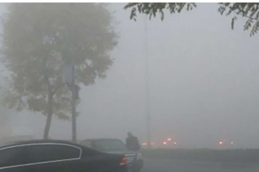 Thick smog envelops a road in the capital. Photo: SCMP Pictures