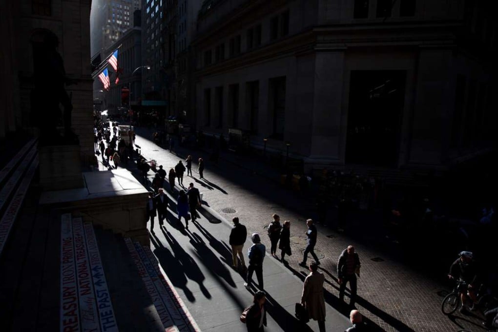 Pedestrians walk along Wall Street in New York. America was a child of the Enlightenment and it would embrace the most universal and advanced principles available. Photo: Bloomberg