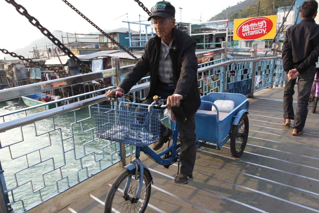 A local rides bicycle over a bridge in Tai O. Photo: SCMP Pictures