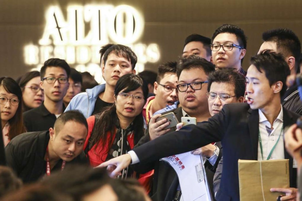 People turn up for the sale of flats at Alto Residences – but not in the numbers normally seen. Photo: Jonathan Wong