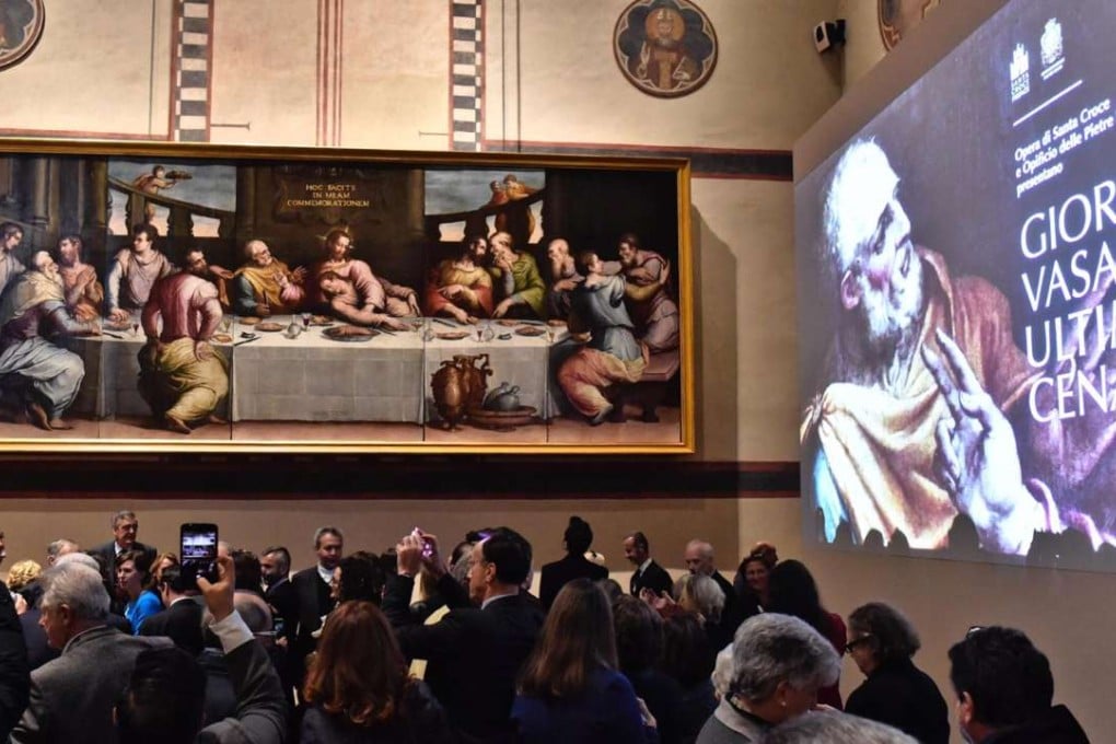 People attend the presentation of Giorgio Vasari’s The Last Supper, after years of painstaking restoration, as it is returned to the Santa Croce Basilica in Florence. Photo: AP
