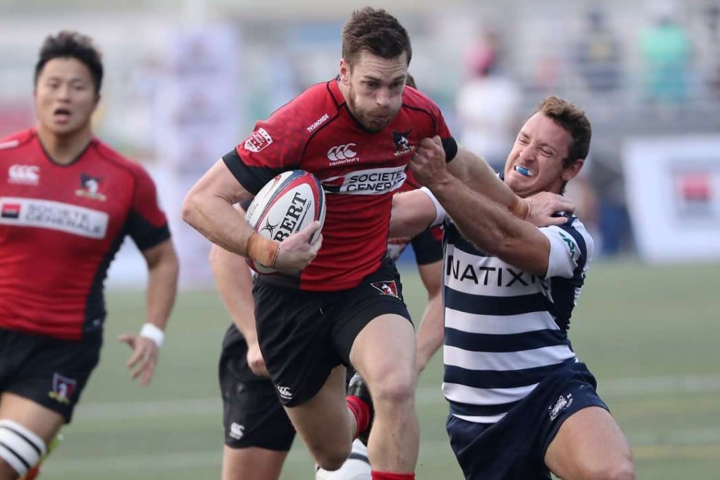 Valley’s Doug Fluker takes on HKFC’s Niall Rowark in the HKRU Premiership on Saturday. Photo: Edward Wong