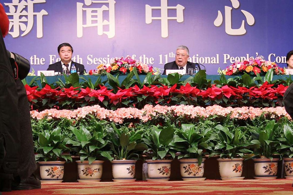 Minister of Civil Affairs Li Liguo speaks at a press conference during the National People's Congress meeting in Beijing in March 2011. On the left is Vice-Minister Dou Yupei, and right, Vice-Minister Jiang Li. Photo: SCMP Pictures