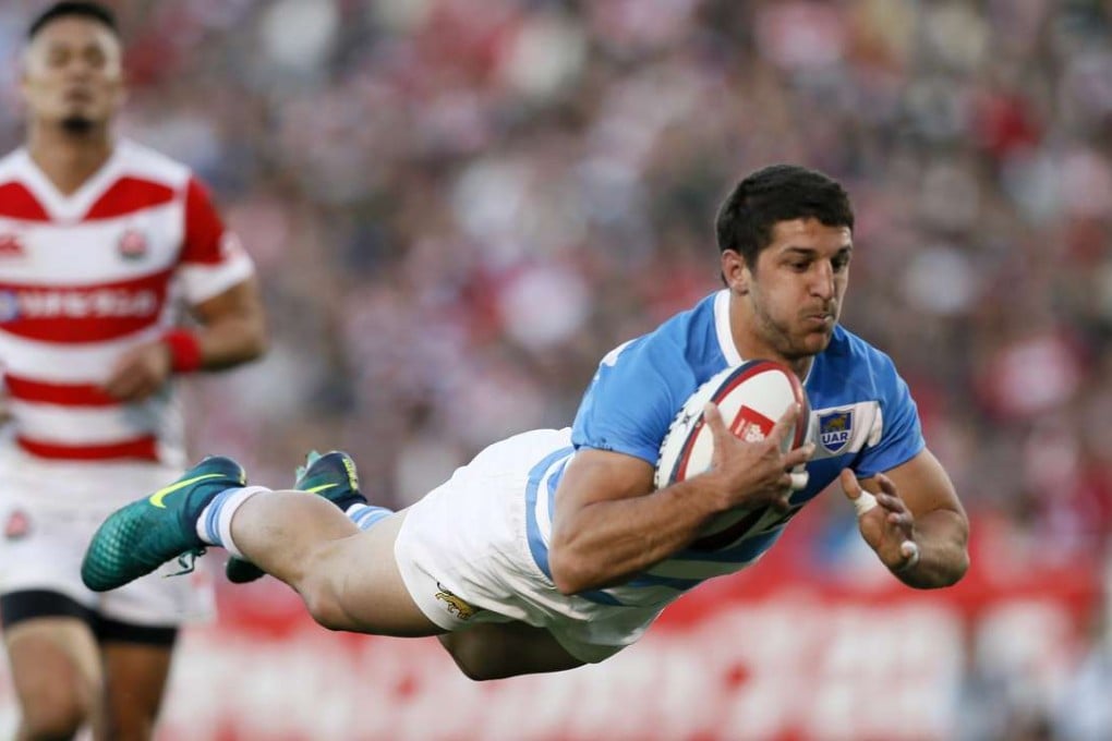 Tomas Cubelli dives over for Argentina’s seventh try against Japan in Tokyo. Argentina won 54-20. Photos: EPA